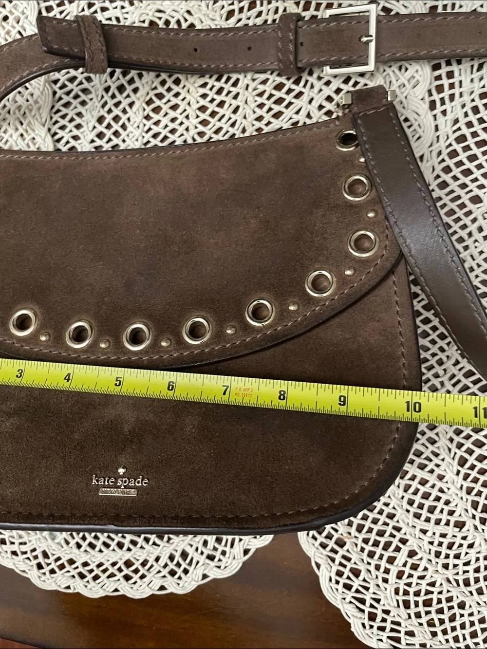 kate spade brown suede eyelet saddle crossbody